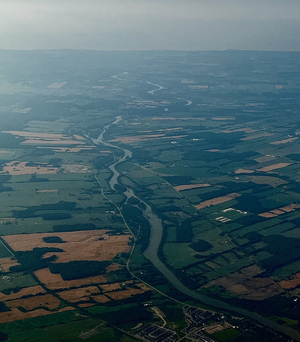The Grand River winding through the landscape, photographed from the sky